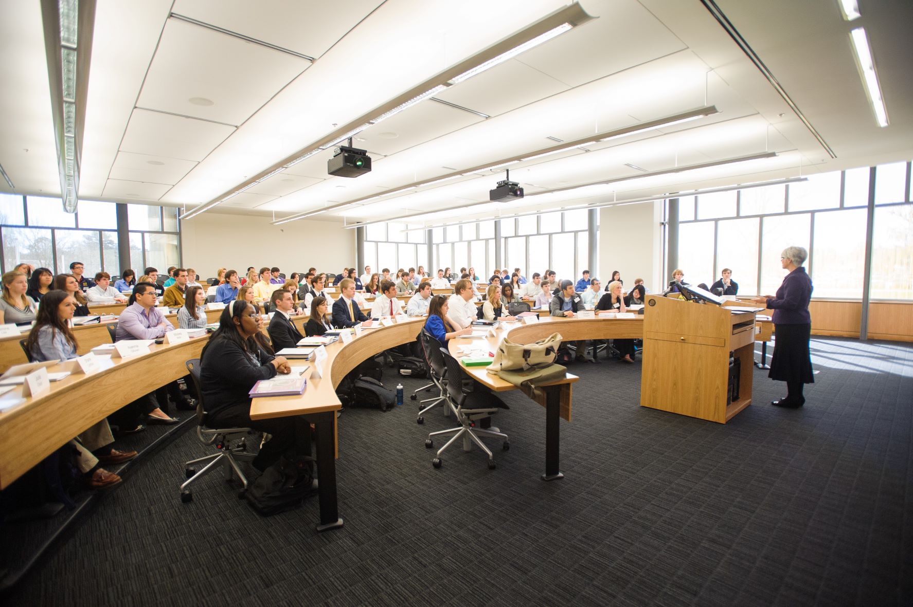 Students in large classroom listening to professor