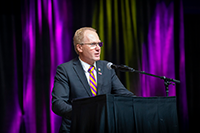 Roy Haggerty giving a speech