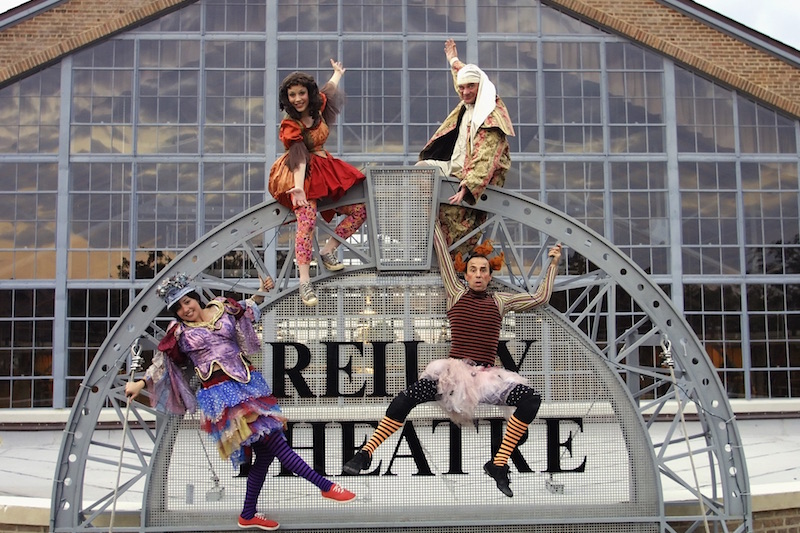 students climbing on the reilly theatre sign