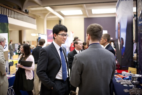 Two LSU students conversing at the Career Expo.