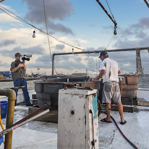 Students film on shrimp boat.