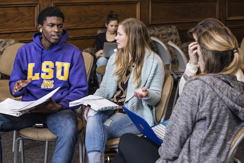 Manship School students talking in the Forum