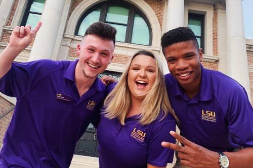 Manship ambassadors smiling in front of Journalism Building